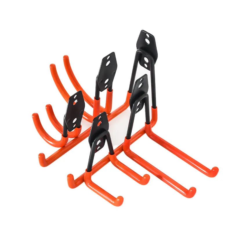 Carbon steel wire-wrap board storage rack with fixed hooks in bright orange finish on wall holding tools