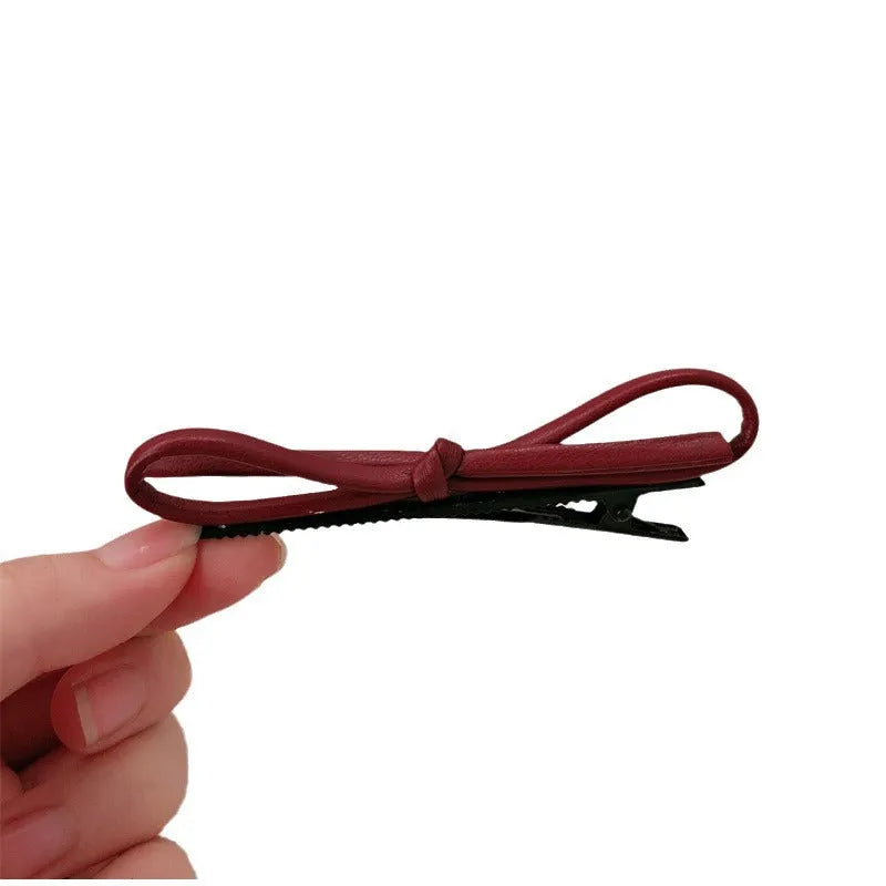 Wine red leather bow barrettes hair clips with structured design