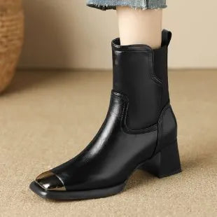 Brown women's cowhide leather Martin boots with a high heel and side zipper on a white background.