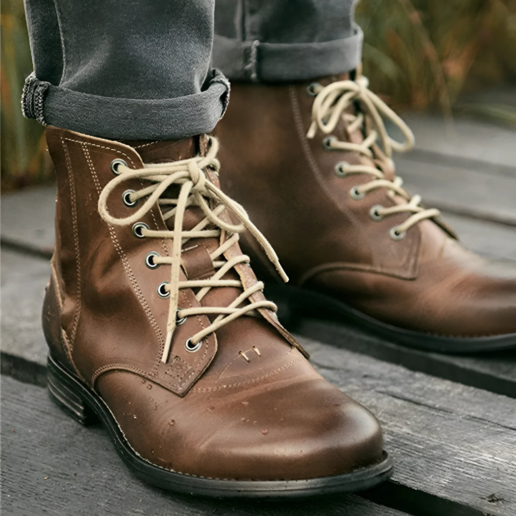 Men's black and brown Knight Series leather boots with a side zipper and low heel.