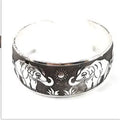 Ethnic carved open Miao silver alloy bracelet in Roman shape with diamond treatment