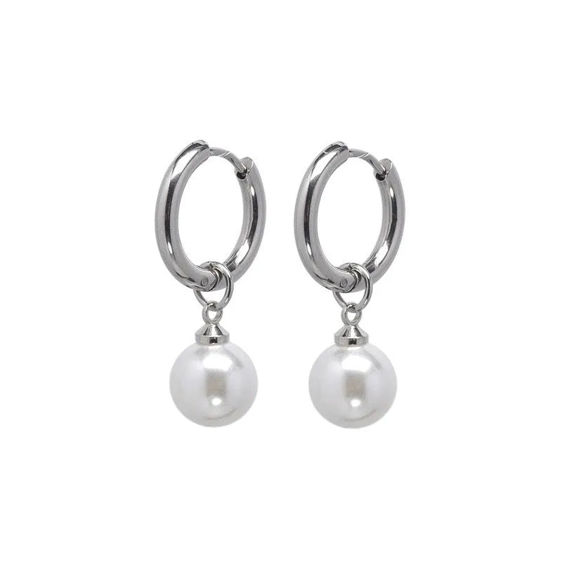 Geometric pearl drop earrings with round elements made from titanium steel alloy