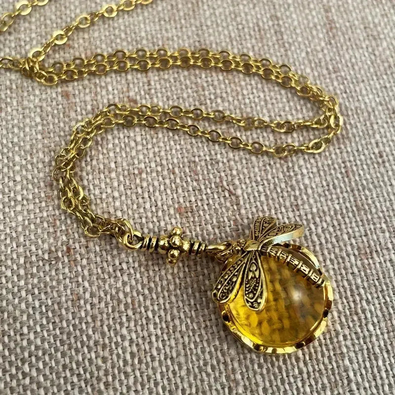 Yellow dragonfly pendant necklace with hand-carved vintage bronze design on 925 silver