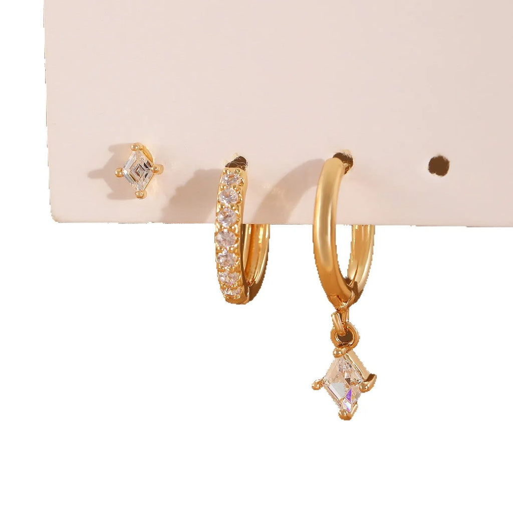 Copper jewellery three-piece set showing ear ring, ear clip, and ear studs with geometric zircon designs