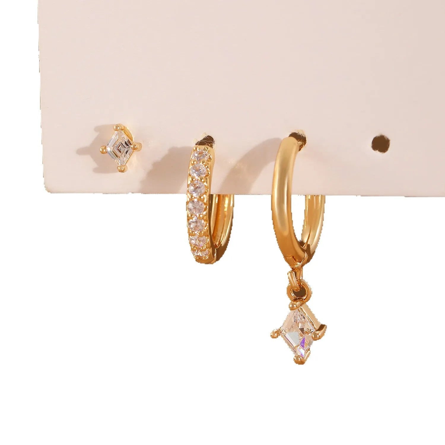 Copper jewellery three-piece set showing ear ring, ear clip, and ear studs with geometric zircon designs
