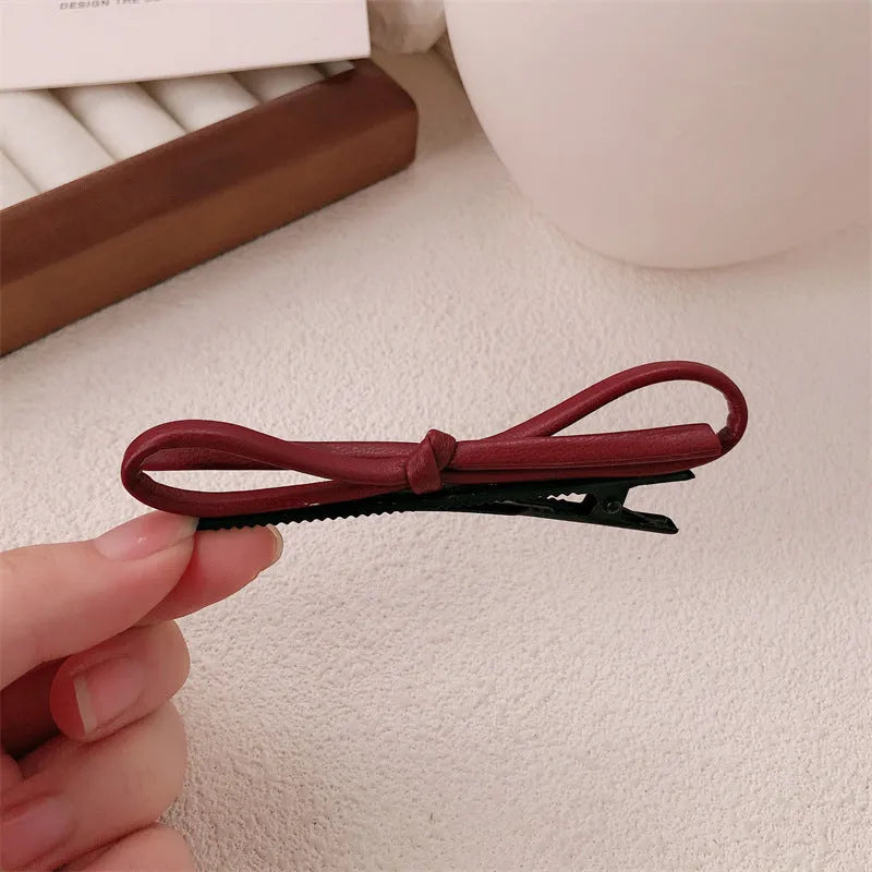 Wine red leather bow barrettes hair clips with structured design