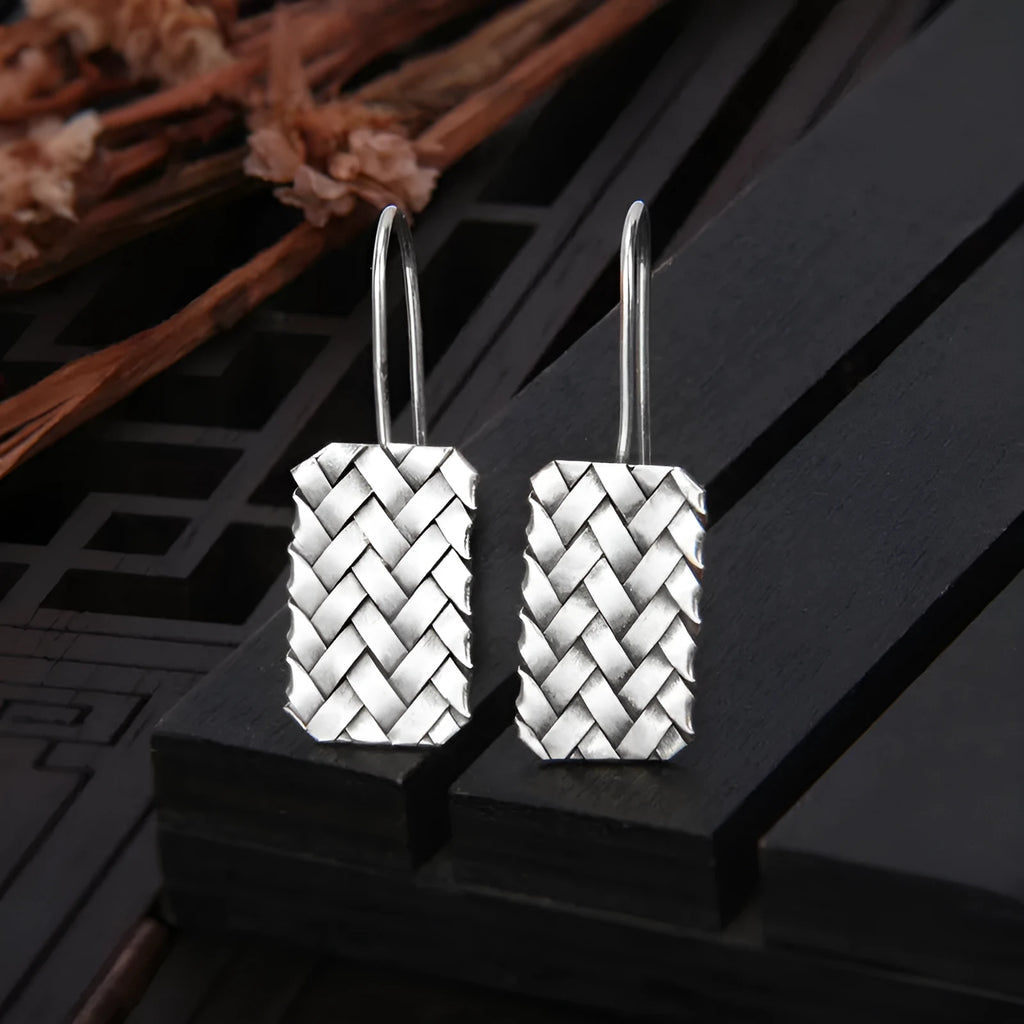 925 silver geometric woven diamond plaid earrings on a plain background