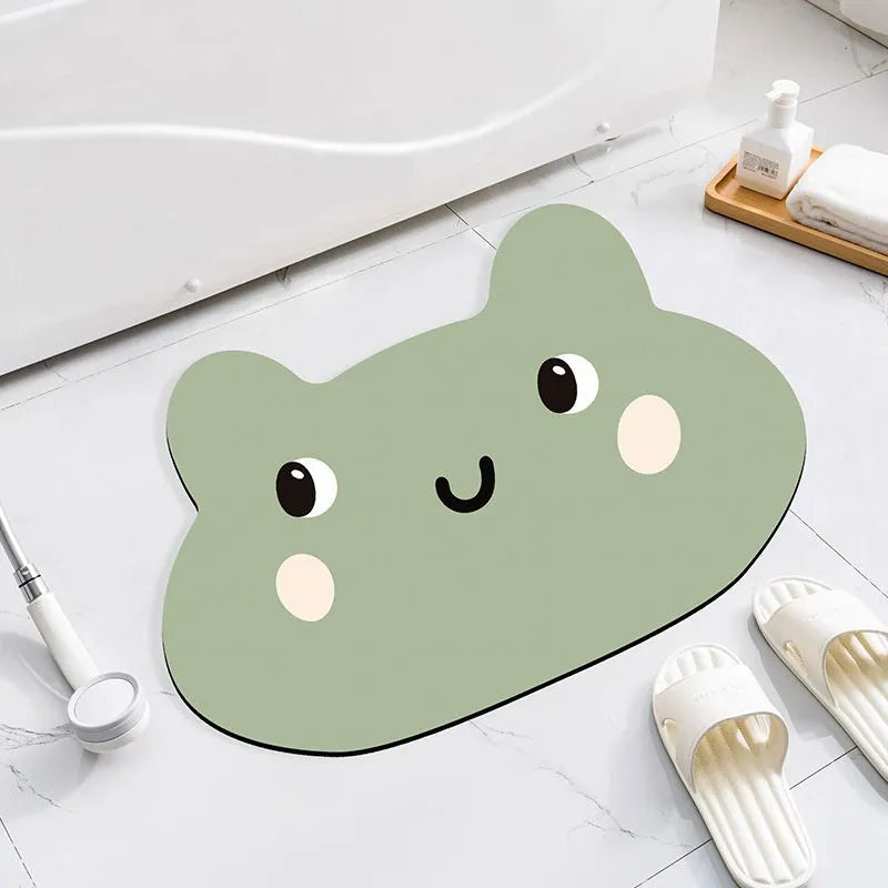 Cartoon animal diatom ooze bathroom mat in sizes 40x60cm, 50x80cm, 60x90cm on a bathroom floor.