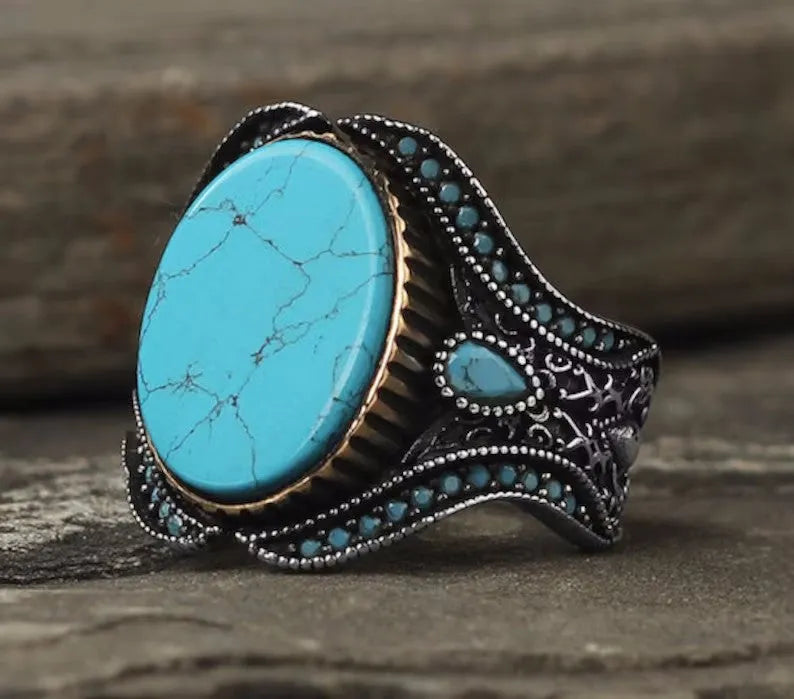 Men's antique silver alloy ring with a round band and a central turquoise-coloured stone.