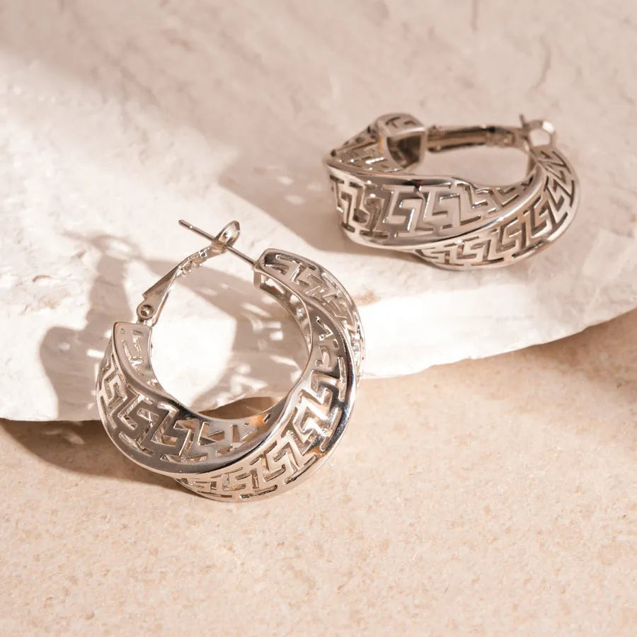 Women's geometric stud earrings with twisted round hollow design in silver or gold electroplated finish