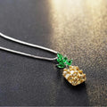 Silver women's necklace with a geometric pineapple and diamond design pendant on a chain.