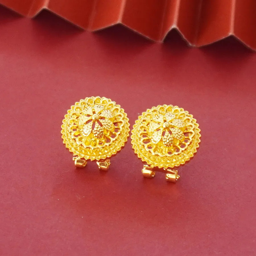 Landscape Middle East gold-plated three-piece jewellery set showing necklace, earrings, and ring with layered floral design.