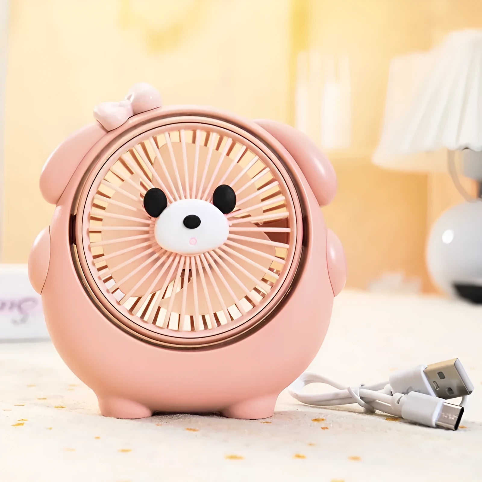 Cute dog-themed USB desktop fan in choice of puppy and bear colours on a desk