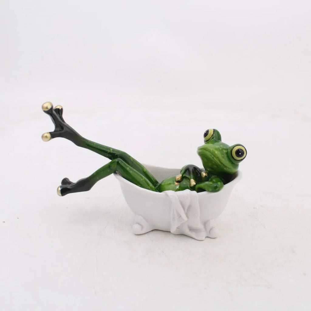 A detailed pastoral-style decorative frog ornament made from beige synthetic resin, approximately 10 cm tall.