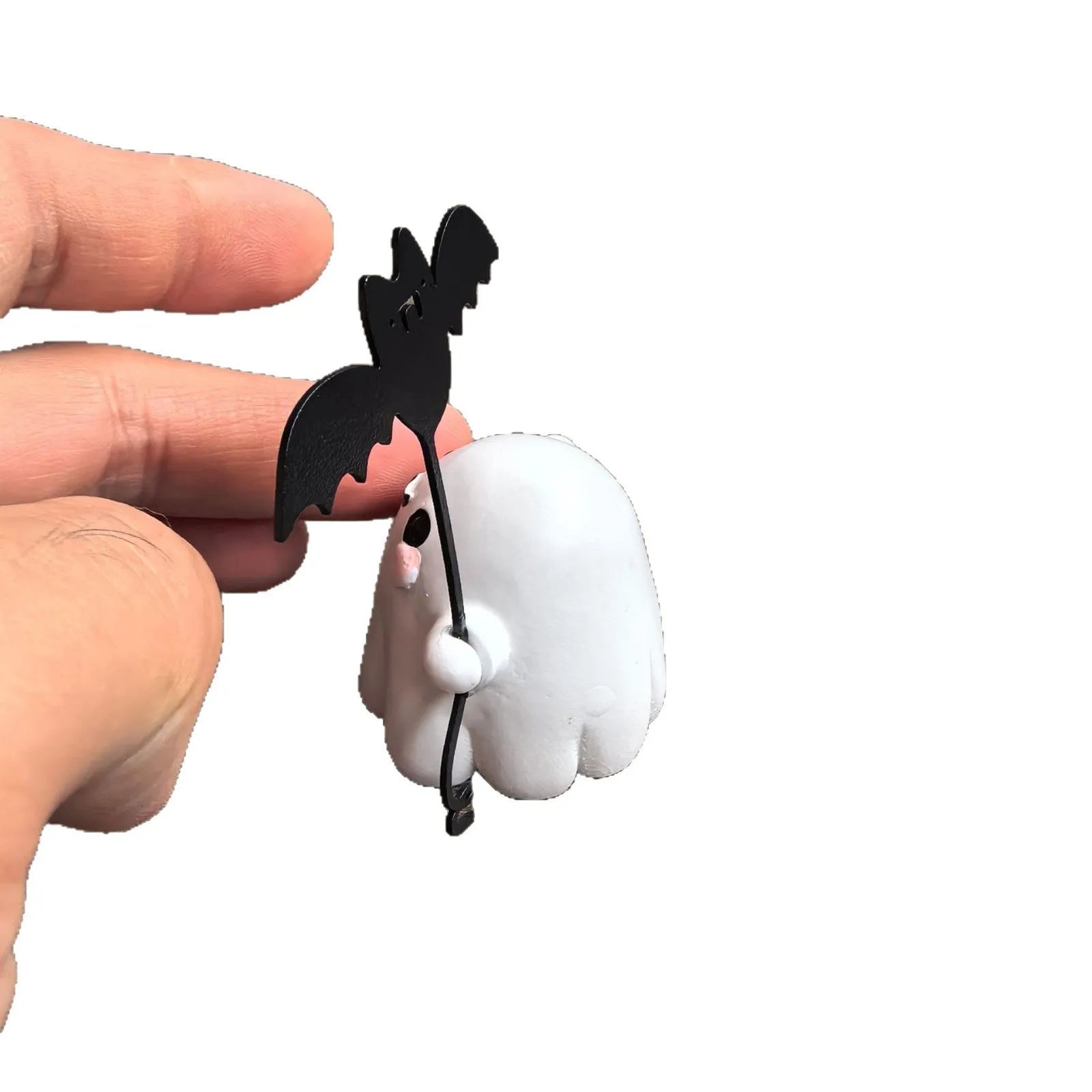 Miniature resin statue of a ghost walking a dog, Halloween decoration measuring 4x5x4cm.