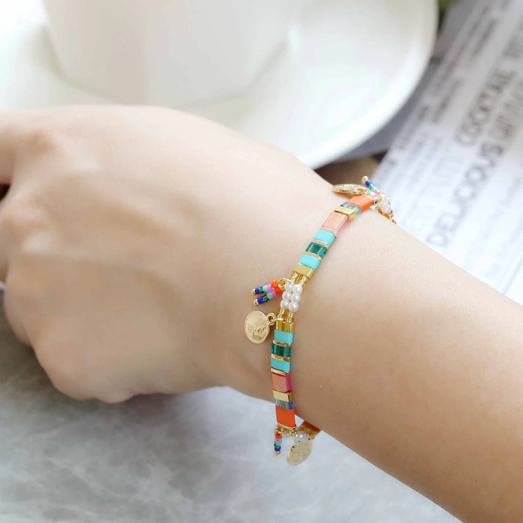 Women's handmade bracelet with imitation pearls and glass coloured beads in six colour options