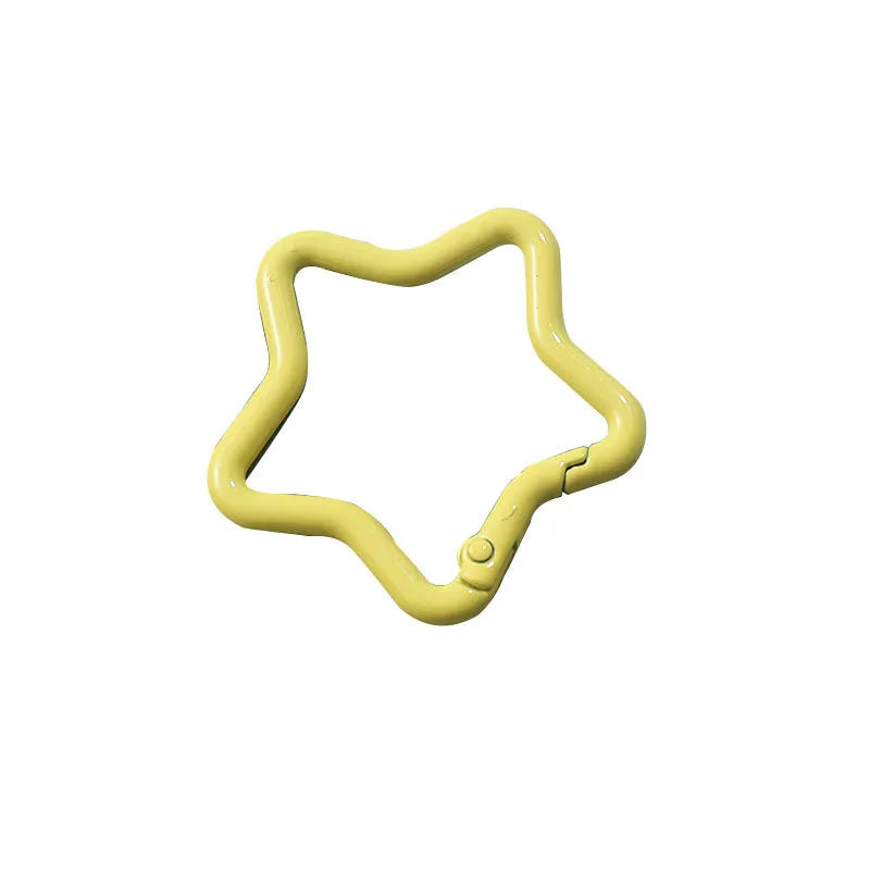 Zinc alloy five-pointed star keychain charm in multiple colour options on a keyring.