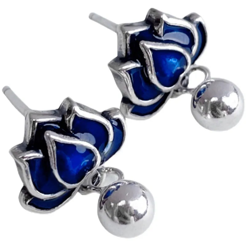Blue lotus flower alloy earrings with seedpod and tassel design, silver plated, shown at actual size of 1.2cm wide.