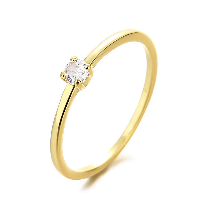 Copper geometric circle ring for women featuring a single central diamond, shown in blue.