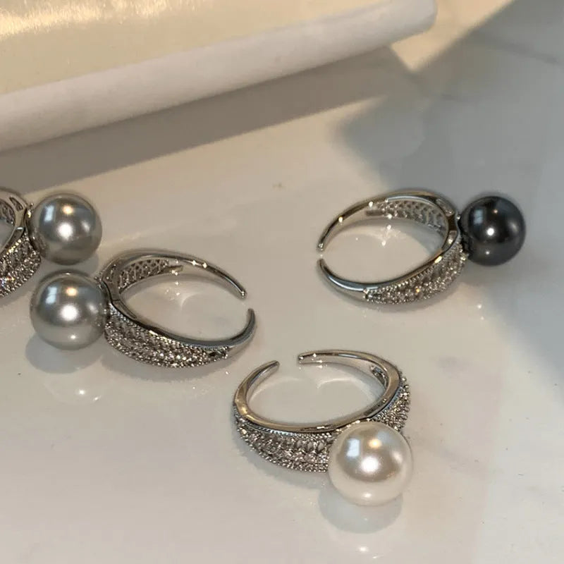 Black pearl geometric open ring with adjustable opening on index finger