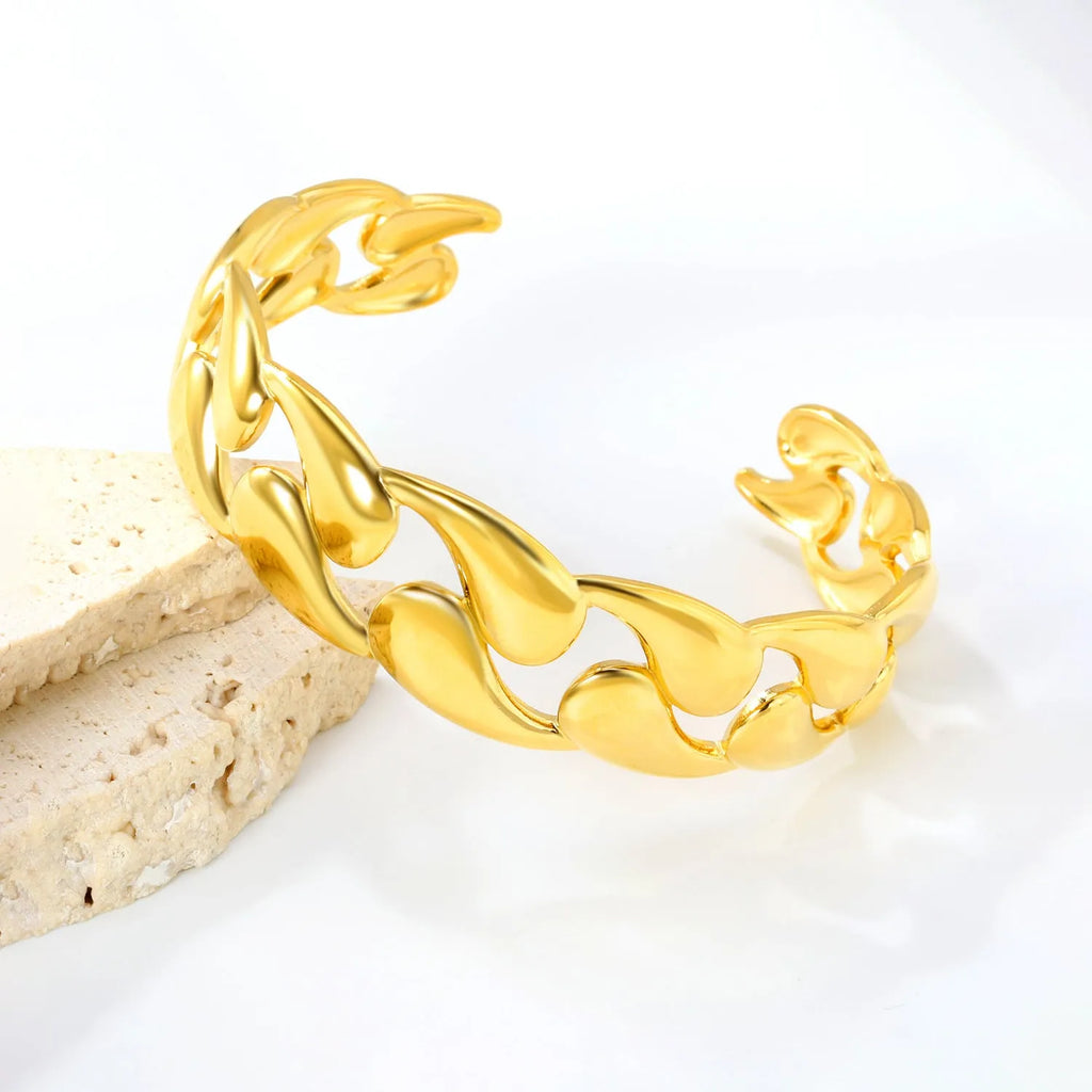 Stainless steel European and American style luxe bracelet on a wrist, showing advanced metallic finish.
