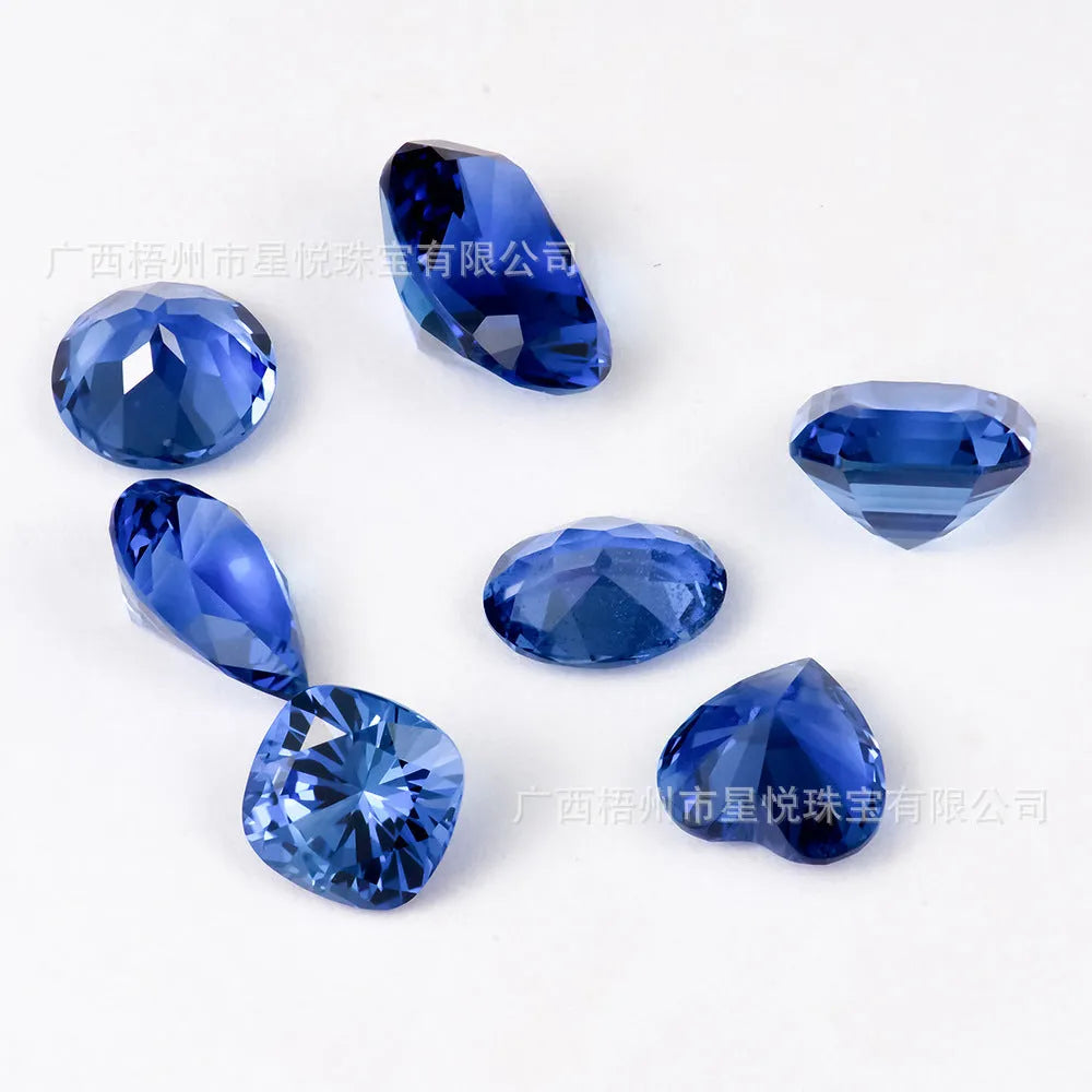 Royal blue love heart tiara shaped gemstones showing round, heart, pear, Asche, egg, fat square, and fat rectangular cuts