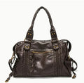 Women's brown retro shoulder messenger bag made of soft PU, showing weaving detail and a single strap.