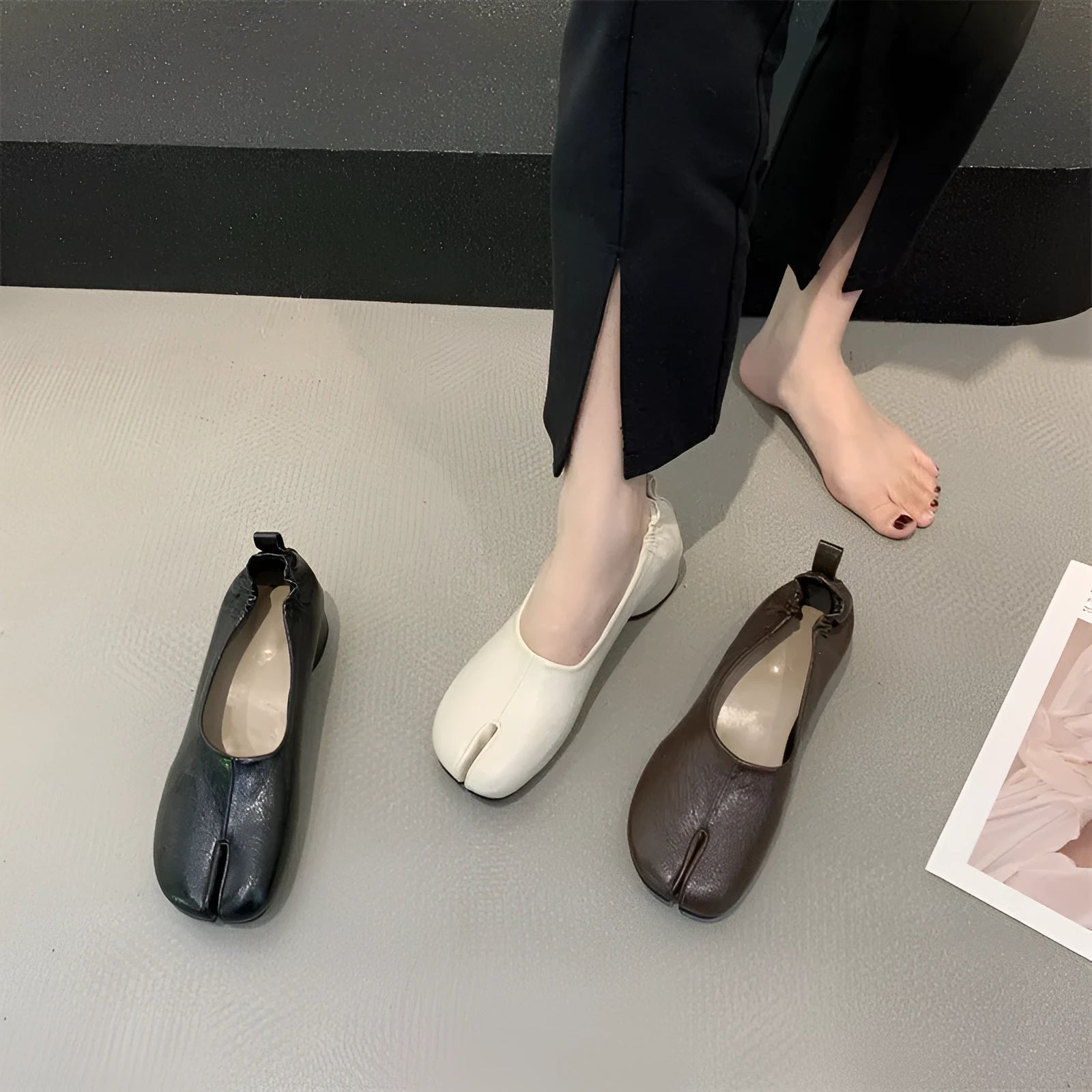 Women's round toe pumps with a split toe horseshoe design and a chunky low heel.