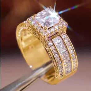 Geometric women's ring in gold or white electroplated alloy showing round elements and UK size markings
