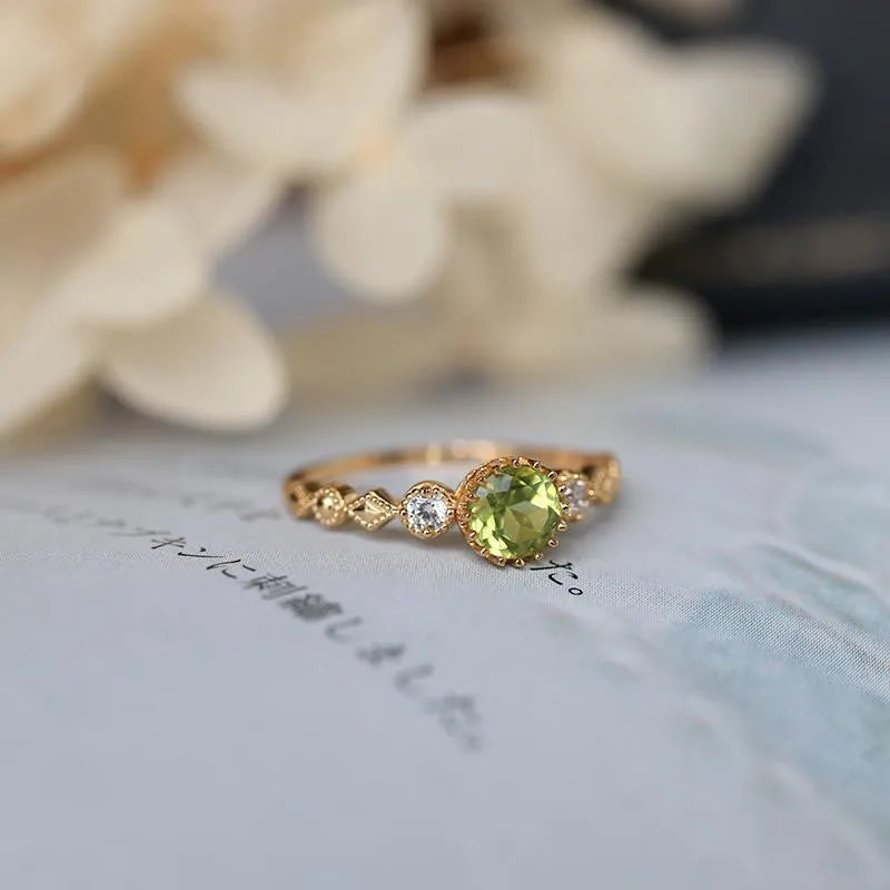 Japanese style copper ring with quadrilateral geometric design and imitation peridot centrepiece