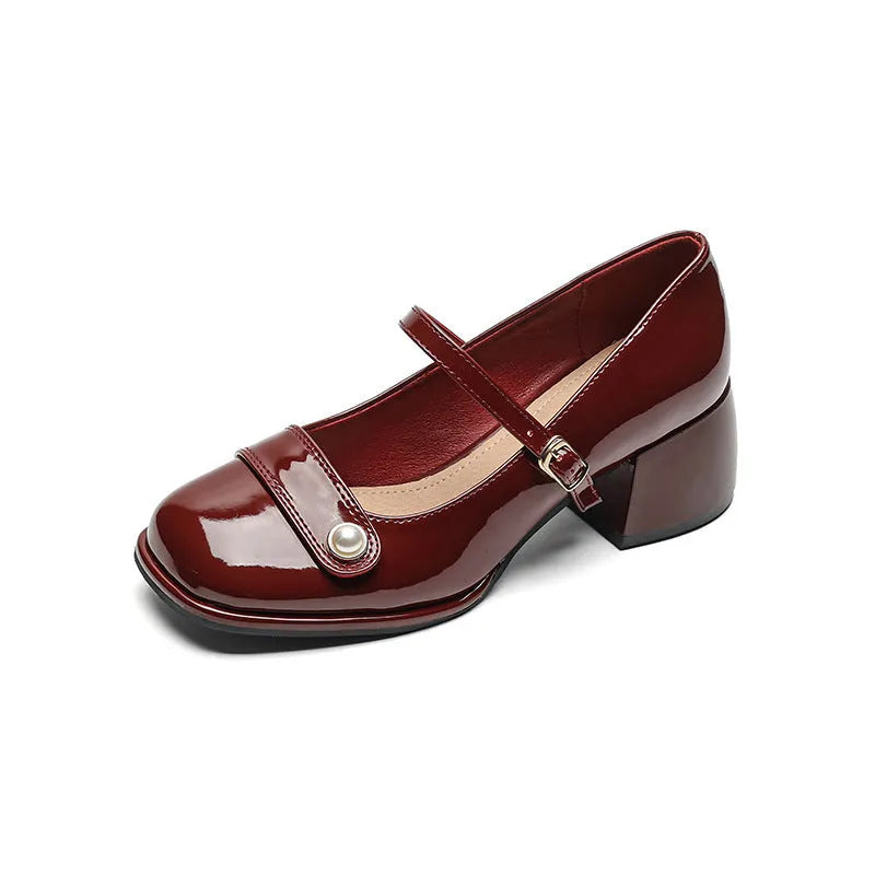 Apricot-coloured plus size hiking boots with a chunky heel, patent leather upper, and buckle fastening.