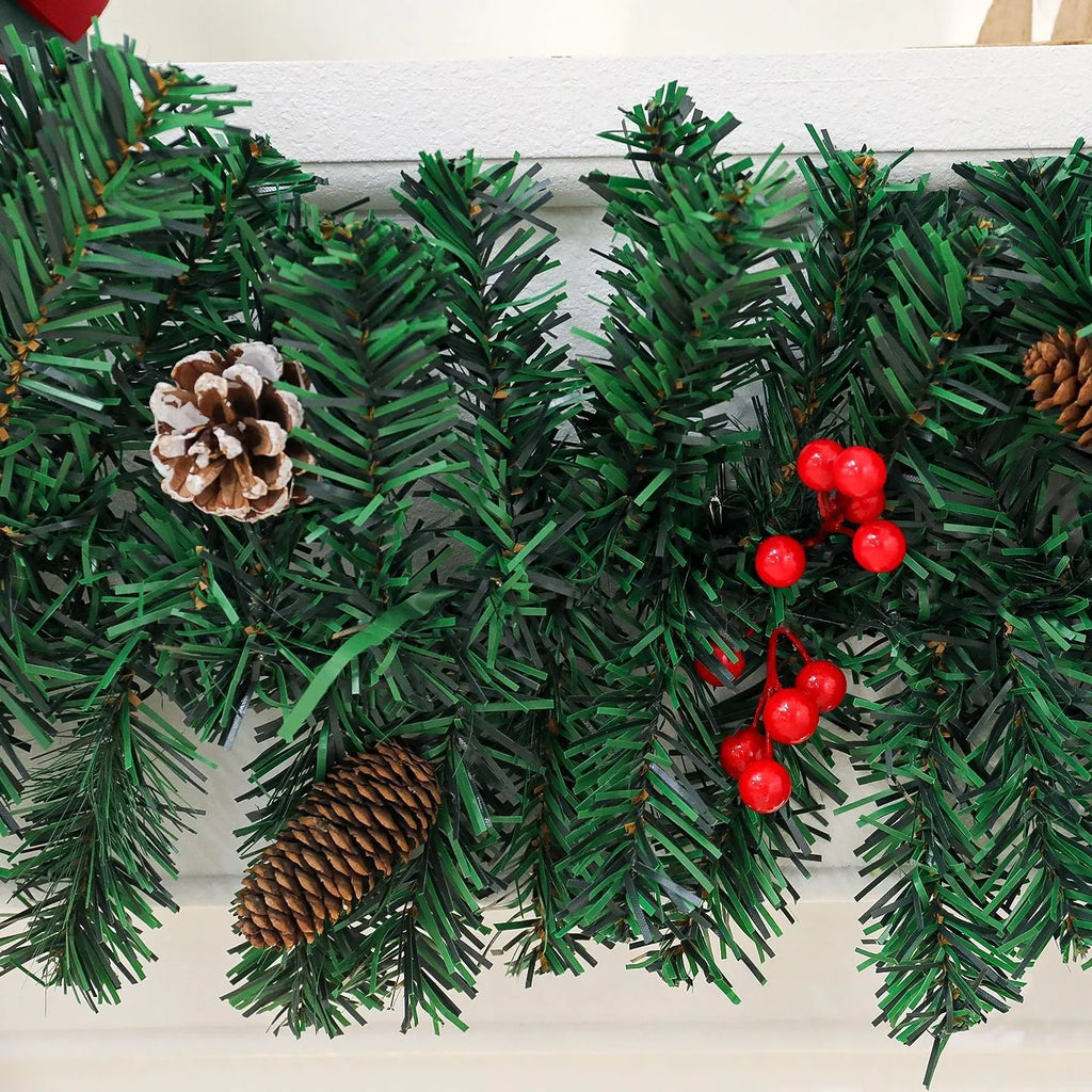 Christmas rattan wreath decoration with pine cones and red bow on green background