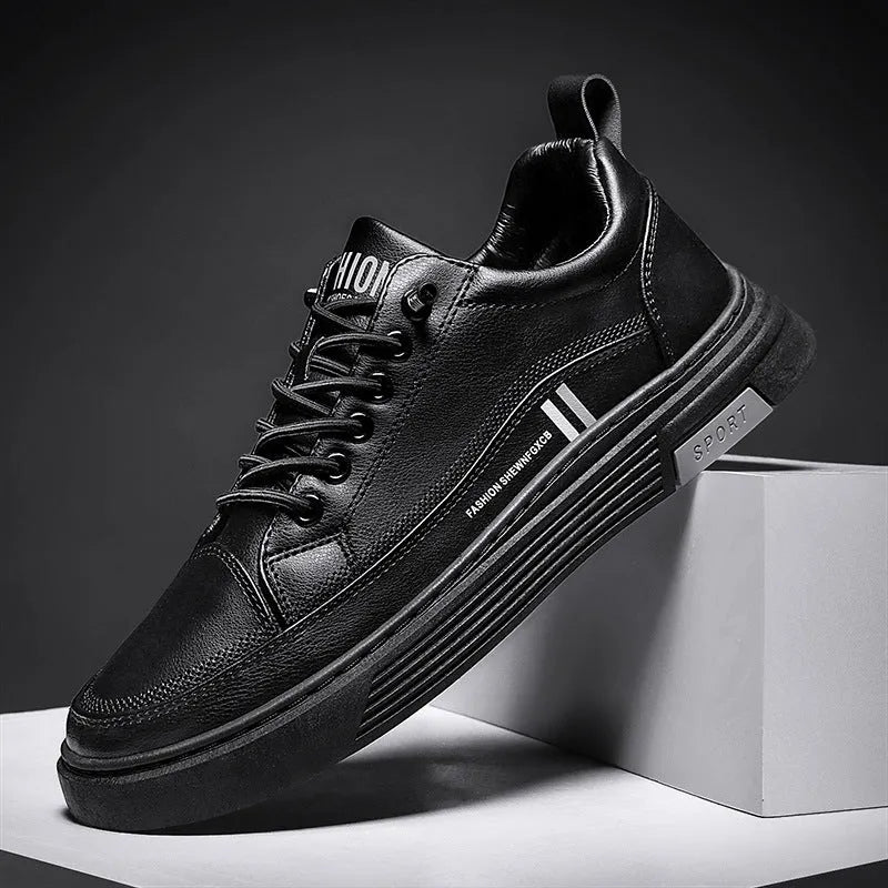 Men's low-top black and white skateboard shoes with elastic band closure and round toe.