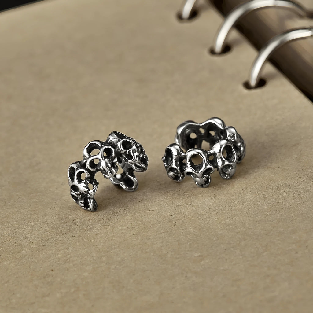 Stainless steel retro skull ear clip earrings with hollow geometric design