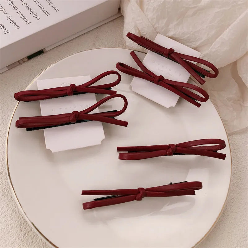 Wine red leather bow barrettes hair clips with structured design