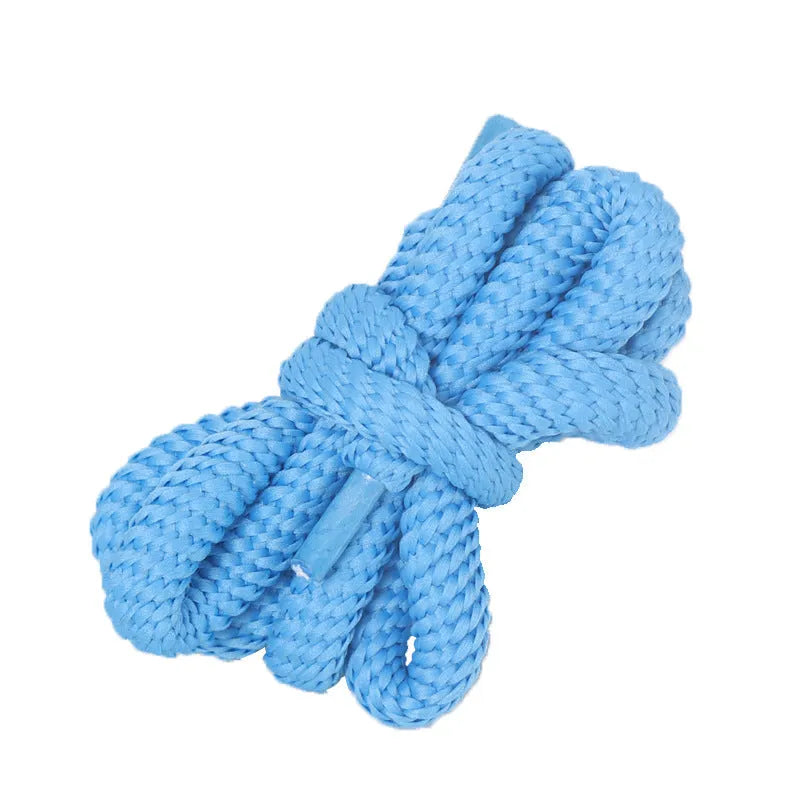 A pair of black oval shoelaces with round profile next to colour swatches showing pink, blue, gray, and orange options.