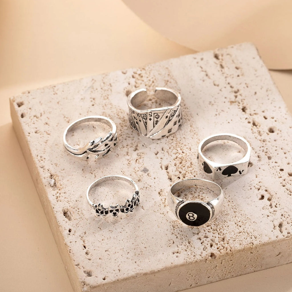 Black alloy poker ring with raised spade card design on band