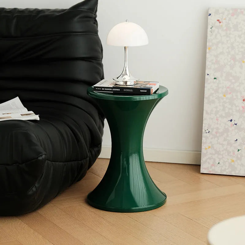 Plastic hourglass-shaped shoe changing stool in selected colour