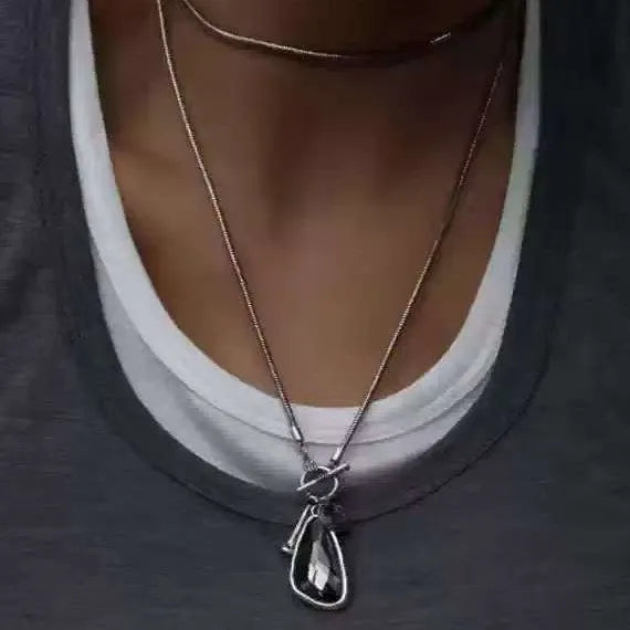 Geometric alloy pendant on long snake bones chain necklace in blue, champagne, or grey colour