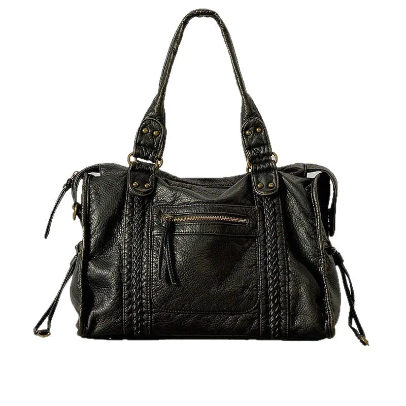 Women's brown retro shoulder messenger bag made of soft PU, showing weaving detail and a single strap.