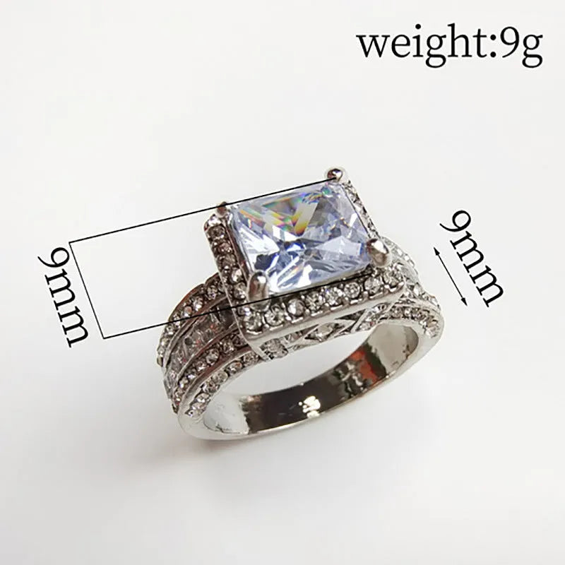Geometric women's ring in gold or white electroplated alloy showing round elements and UK size markings