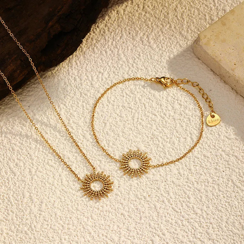 Gold sunflower necklace and bracelet set for women with geometric design