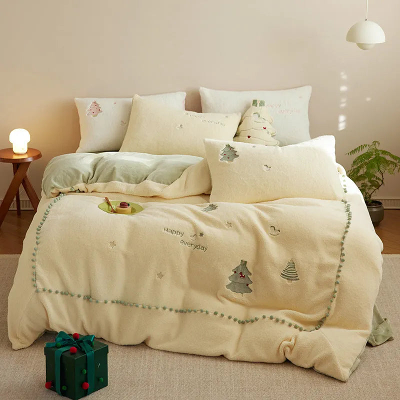 Milk fibre bedding four-piece set with green Christmas tree pattern showing quilt cover, sheet, and pillowcases