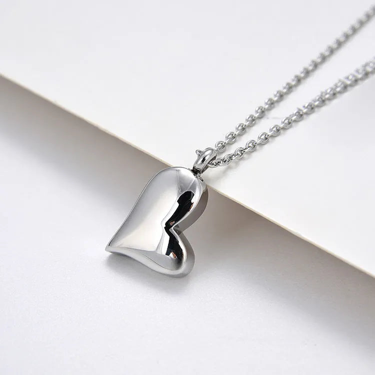 Silver curved heart pendant on adjustable stainless steel necklace chain