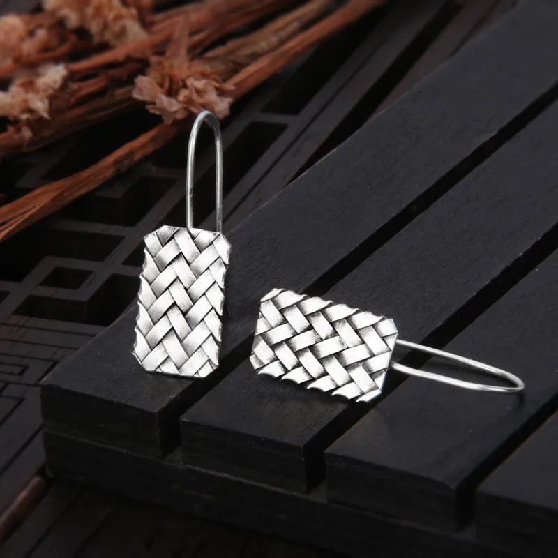 925 silver geometric woven diamond plaid earrings on a plain background