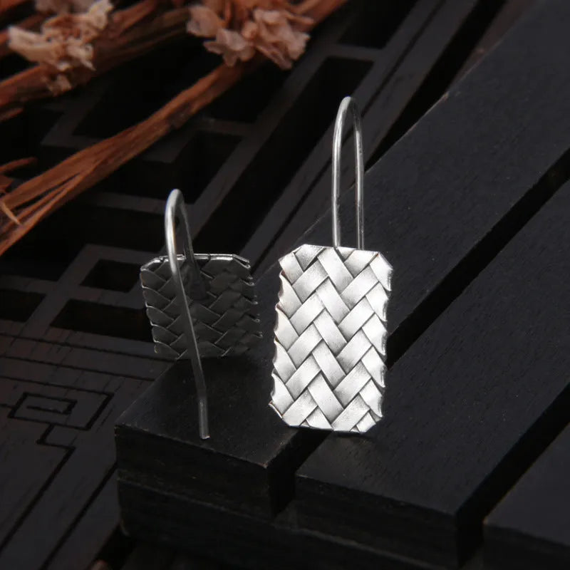 925 silver geometric woven diamond plaid earrings on a plain background
