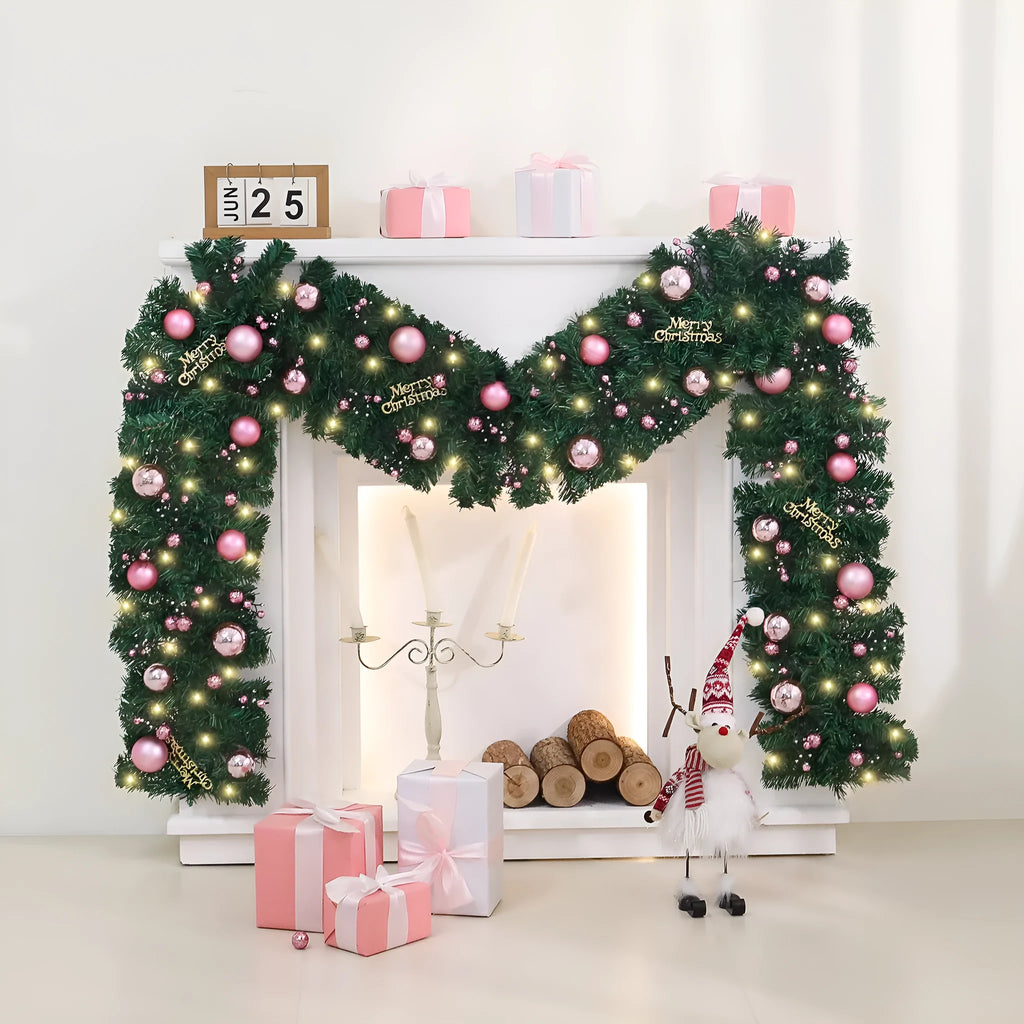 Pink Christmas rattan vine garland draped in a loop, showing small fruit details and LED lights.