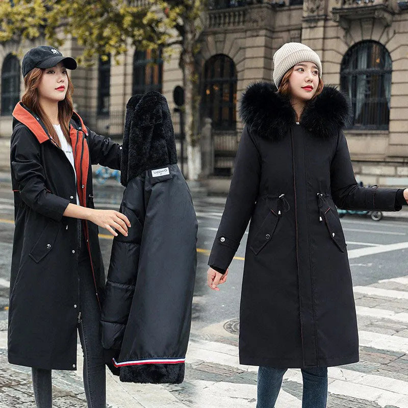 Women's long white padded trench coat with down cotton filler and fleece construction on a hanger.