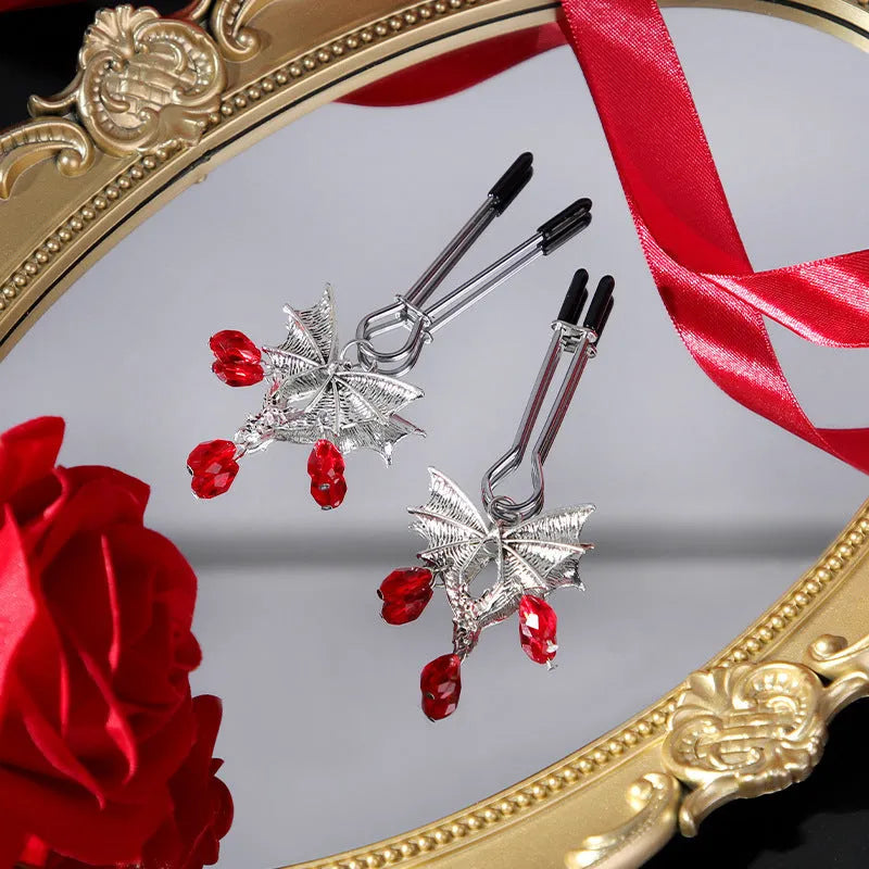 Silver alloy Diamond Bat Nipple Clamp with adjustable screw and ruby bat clip on a white background