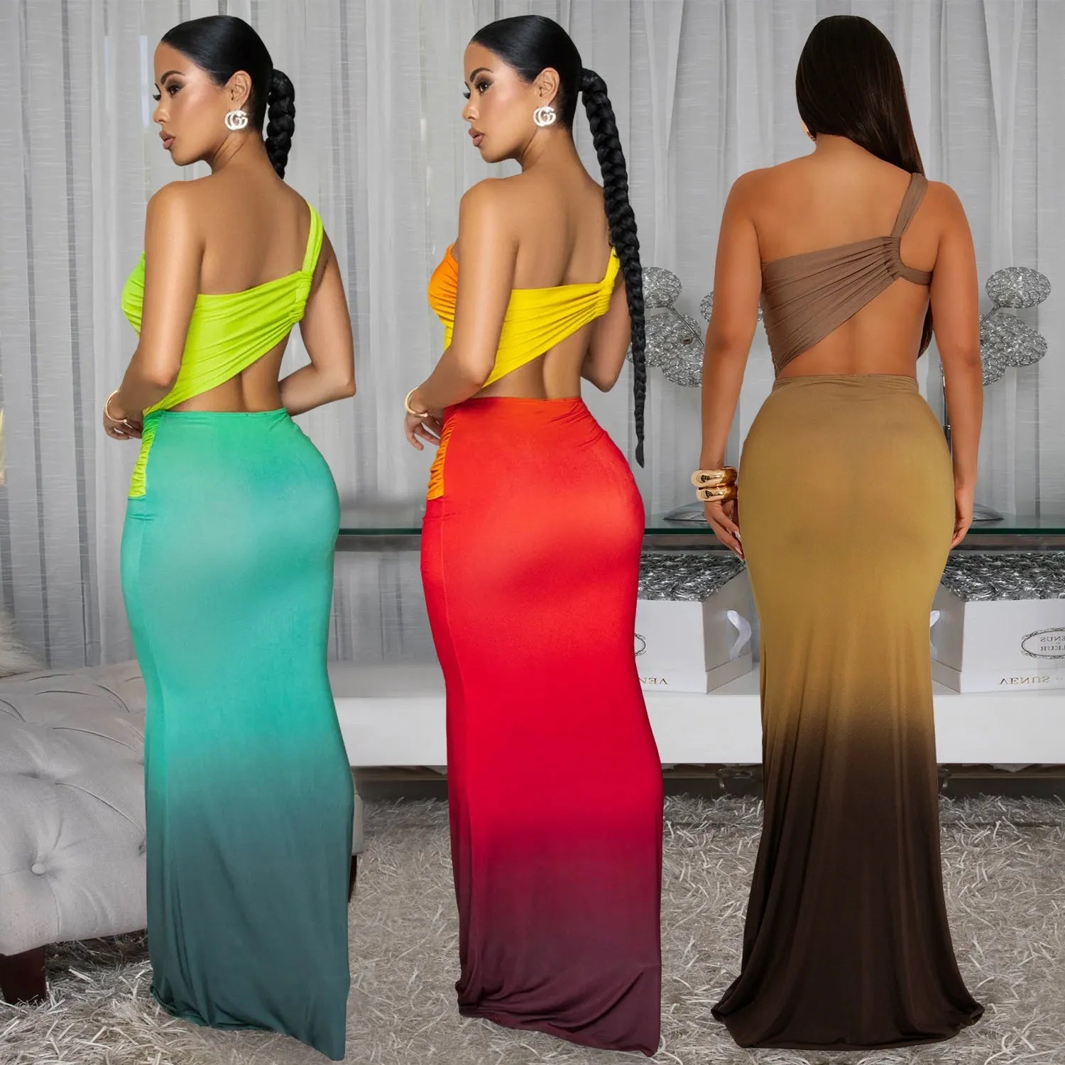 A woman wearing a long gradient colour dress with a cross-shoulder sleeveless design and a high waist.
